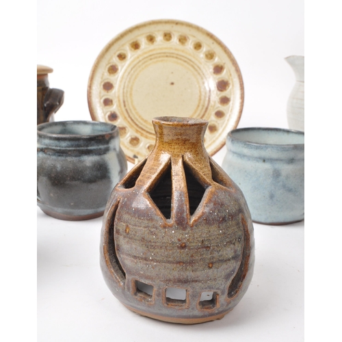 91 - A collection of nine 20th-century studio pottery pieces and stoneware, including ceramic blue glazed... 