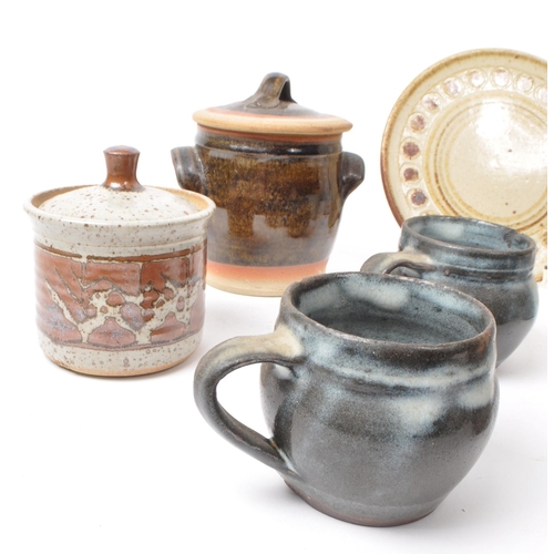 91 - A collection of nine 20th-century studio pottery pieces and stoneware, including ceramic blue glazed... 