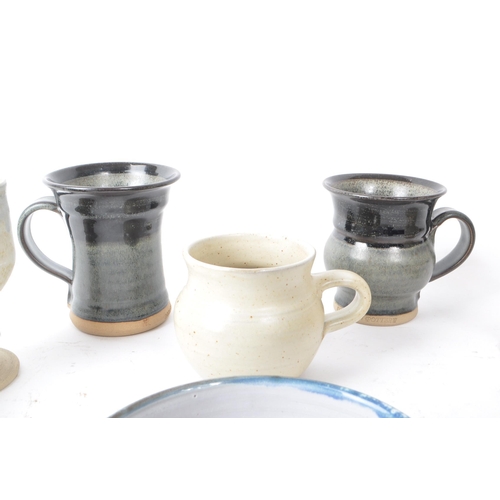 94 - A collection of 20th-century studio pottery stoneware pieces, comprising of ceramic mugs, goblets, a... 