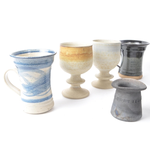 94 - A collection of 20th-century studio pottery stoneware pieces, comprising of ceramic mugs, goblets, a... 