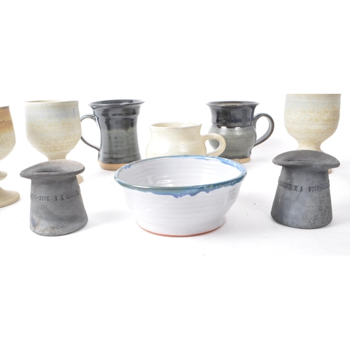 94 - A collection of 20th-century studio pottery stoneware pieces, comprising of ceramic mugs, goblets, a... 