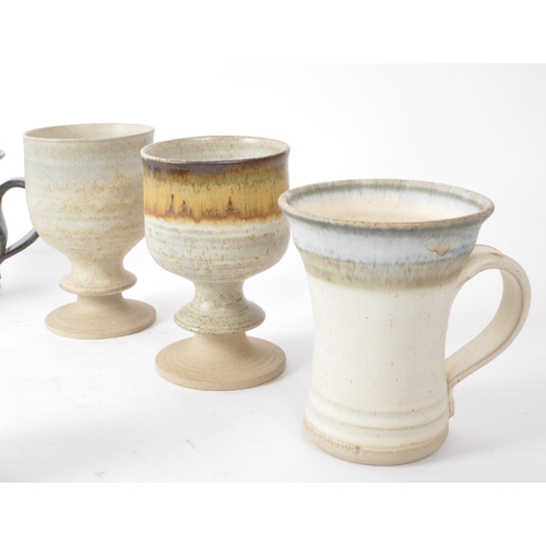 94 - A collection of 20th-century studio pottery stoneware pieces, comprising of ceramic mugs, goblets, a... 