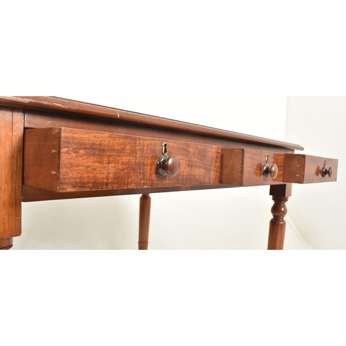 226C - An early 20th century mahogany & leather top writing table desk. The table having a rectangular cham... 