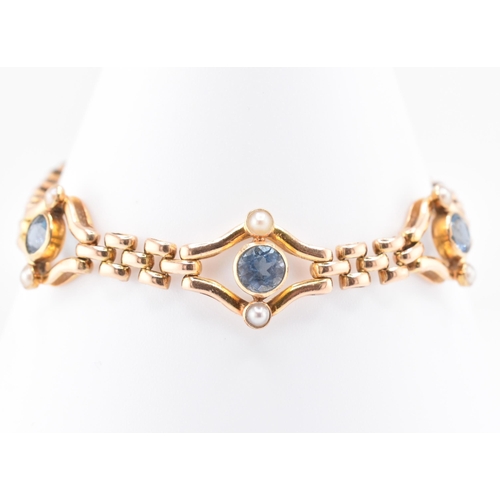 11 - Edwardian 15ct gold blue tourmaline & diamond bracelet. The bracelet set with three tourmaline a... 