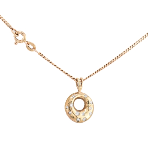 111 - An Italian hallmarked 9ct gold and diamond pendant necklace. The 9ct yellow gold round pierced neckl... 