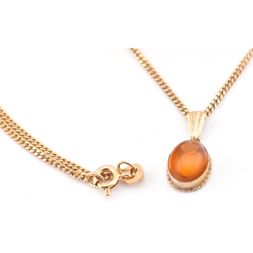 117 - A hallmarked 9ct gold and amber pendant necklace and a pair of stud earrings. The lot to include a h... 