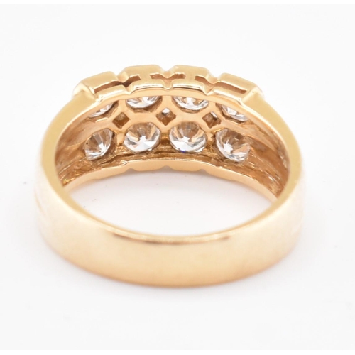 120 - An 18ct gold and diamond cluster ring. The 18ct yellow gold ring set with two rows of round brillian... 