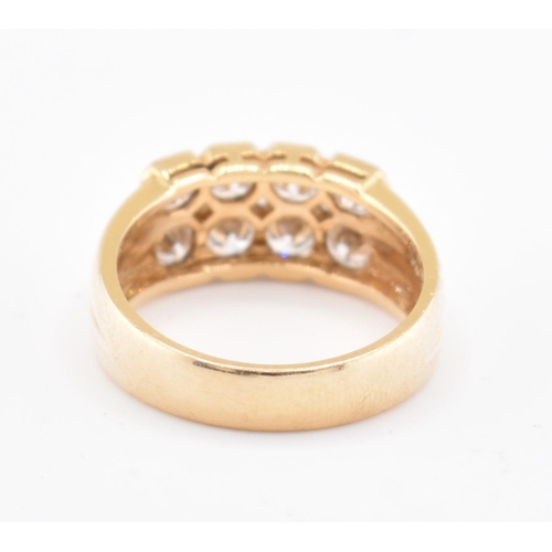 120 - An 18ct gold and diamond cluster ring. The 18ct yellow gold ring set with two rows of round brillian... 