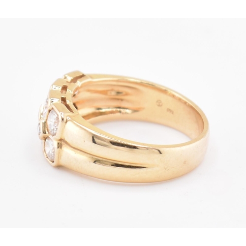 120 - An 18ct gold and diamond cluster ring. The 18ct yellow gold ring set with two rows of round brillian... 