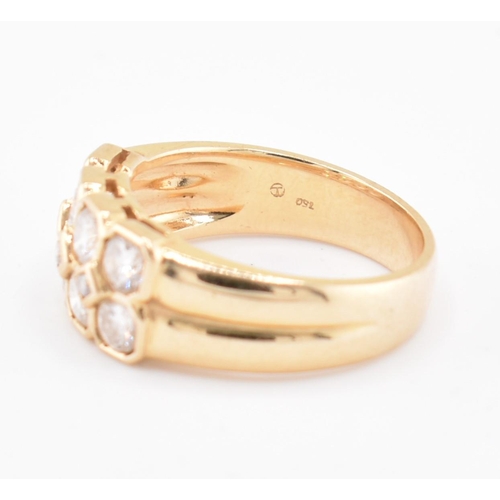 120 - An 18ct gold and diamond cluster ring. The 18ct yellow gold ring set with two rows of round brillian... 