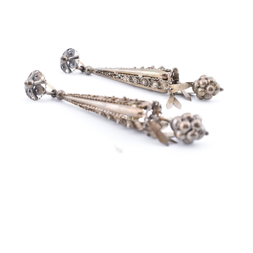 121 - A pair of Victorian drop earrings. The Victorian pendant earrings having hanging tassels surmounted ... 