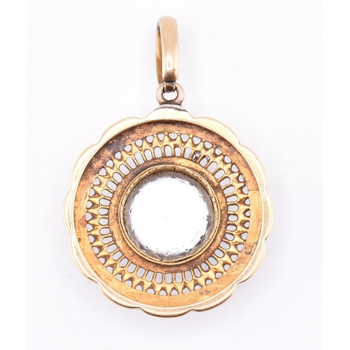 122 - A gold, enamel and topaz set pendant in the manner of Carlo Giuliano. The round gold and enamel neck... 