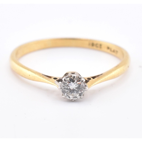 124 - An 18ct gold, platinum and diamond solitaire ring. The 18ct yellow gold ring set with a single eight... 