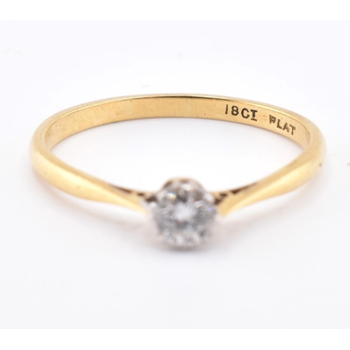 124 - An 18ct gold, platinum and diamond solitaire ring. The 18ct yellow gold ring set with a single eight... 