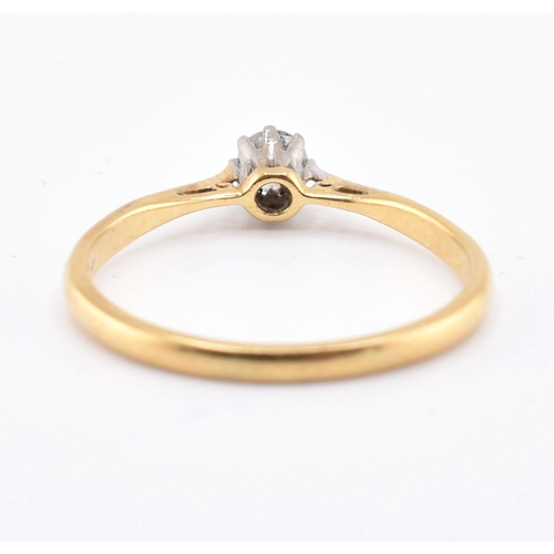 124 - An 18ct gold, platinum and diamond solitaire ring. The 18ct yellow gold ring set with a single eight... 