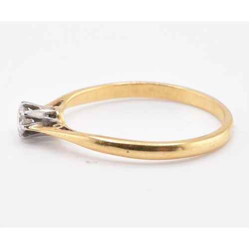 124 - An 18ct gold, platinum and diamond solitaire ring. The 18ct yellow gold ring set with a single eight... 