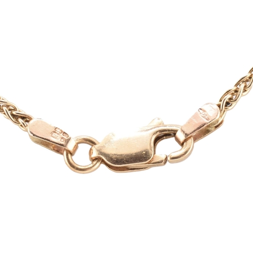 130 - A hallmarked 9ct gold chain necklace. The 9ct yellow gold wheat link chain having a lobster claw cla... 