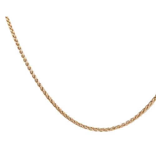 130 - A hallmarked 9ct gold chain necklace. The 9ct yellow gold wheat link chain having a lobster claw cla... 