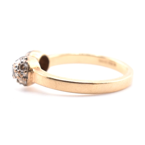 133 - A hallmarked 9ct gold and CZ ball torque ring. The 9ct yellow gold torque ring having two ball finia... 