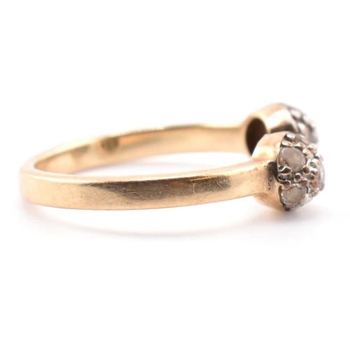 133 - A hallmarked 9ct gold and CZ ball torque ring. The 9ct yellow gold torque ring having two ball finia... 