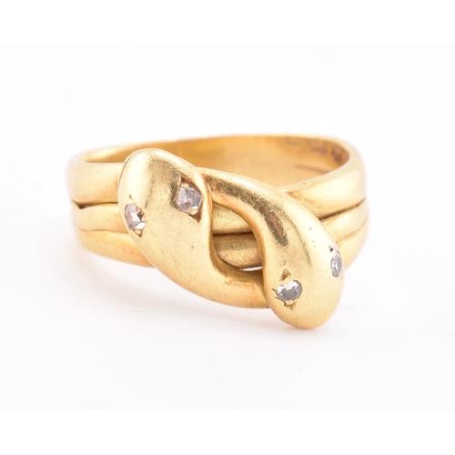 14 - A Victorian hallmarked 18ct gold and diamond snake ring. The 18ct yellow gold ring having two intert... 