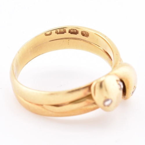 14 - A Victorian hallmarked 18ct gold and diamond snake ring. The 18ct yellow gold ring having two intert... 