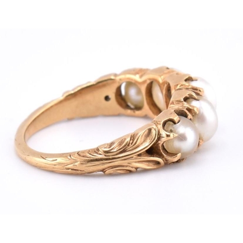 140 - A gold and pearl five stone ring. The gold ring set with five graduating full pearls to decorative s... 