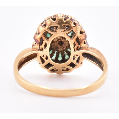 141 - A hallmarked 18ct gold, emerald and diamond ring. The 18ct yellow gold ring having a central bezel s... 