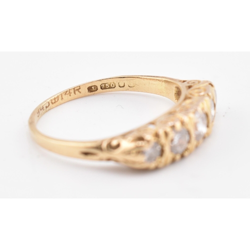 143 - A hallmarked 18ct gold and diamond five stone ring. The 18ct yellow gold ring set with five graduati... 