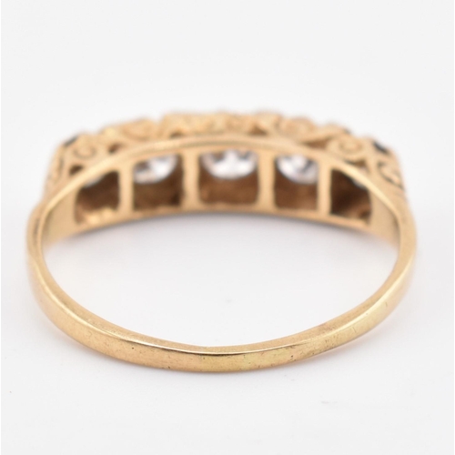 143 - A hallmarked 18ct gold and diamond five stone ring. The 18ct yellow gold ring set with five graduati... 