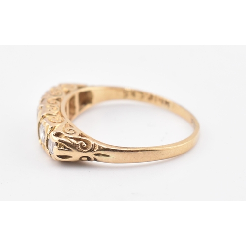 143 - A hallmarked 18ct gold and diamond five stone ring. The 18ct yellow gold ring set with five graduati... 