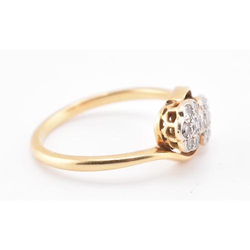 146 - An 18ct gold and diamond crossover ring. The 18ct yellow gold ring having seven round brilliant cut ... 