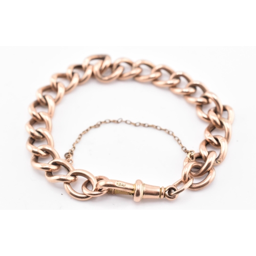 149 - A hallmarked 9ct gold curb link bracelet. The 9ct rose gold curb link bracelet having a dog lead cla... 