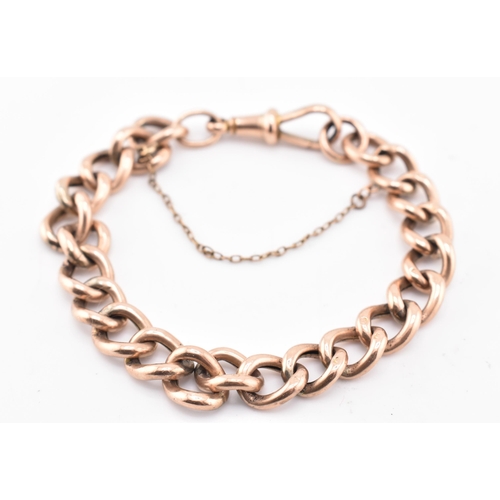 149 - A hallmarked 9ct gold curb link bracelet. The 9ct rose gold curb link bracelet having a dog lead cla... 