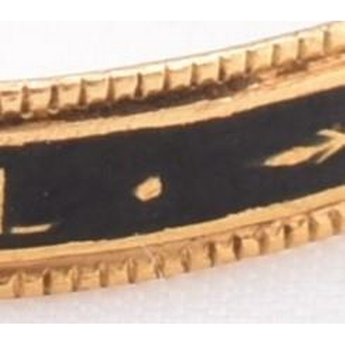 152 - An antique Georgian gold and enamel decorated mourning ring. The ring decorated with black enamel in... 