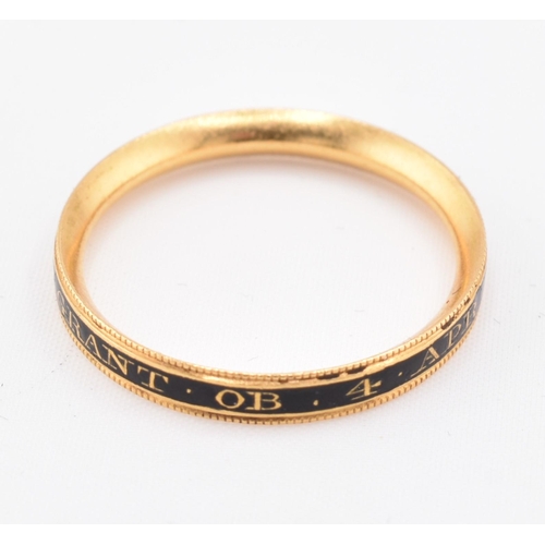 152 - An antique Georgian gold and enamel decorated mourning ring. The ring decorated with black enamel in... 