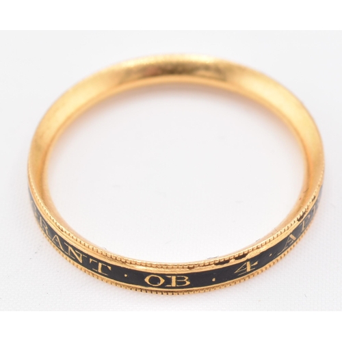 152 - An antique Georgian gold and enamel decorated mourning ring. The ring decorated with black enamel in... 