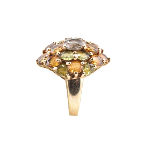 153 - A hallmarked 9ct gold and sapphire cluster ring. The yellow gold ring set with a central oval cut sa... 