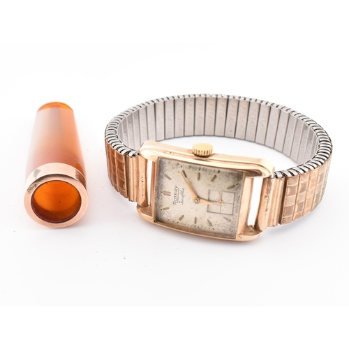 154 - A hallmarked 9ct gold Rotary wristwatch together with a cased gold mounted cheroot holder. The lot t... 