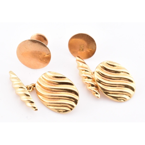 155 - A pair of 18ct gold marked torpedo cufflinks and 2 button studs. All marked 18ct. Total weight 10.25... 