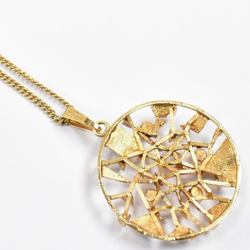 155a - A Mid Century gold plated brutalist pendant necklace. The necklace having gold plated textured geome... 