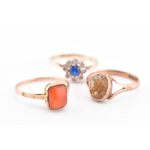 159 - Three 9ct gold and gem set rings AF. The lot to include a hallmarked 9ct yellow gold and gem set clu... 