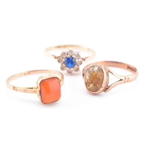 159 - Three 9ct gold and gem set rings AF. The lot to include a hallmarked 9ct yellow gold and gem set clu... 