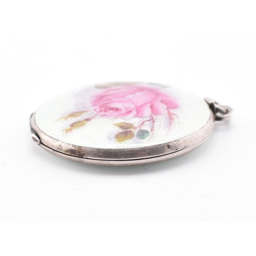 16 - An Edwardian 935 silver and guilloche enamel locket pendant. The locket having enamel decorated pane... 