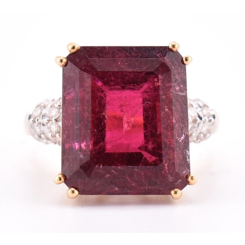 160 - A hallmarked 18ct gold pink tourmaline and diamond ring. The 18ct yellow gold ring set with a centra... 