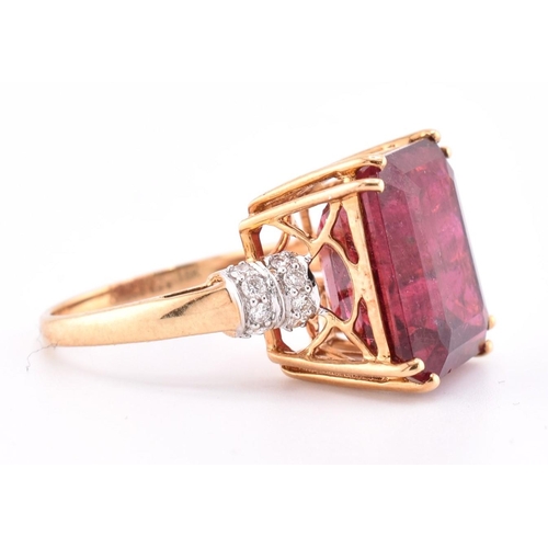 160 - A hallmarked 18ct gold pink tourmaline and diamond ring. The 18ct yellow gold ring set with a centra... 