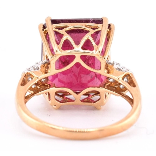 160 - A hallmarked 18ct gold pink tourmaline and diamond ring. The 18ct yellow gold ring set with a centra... 