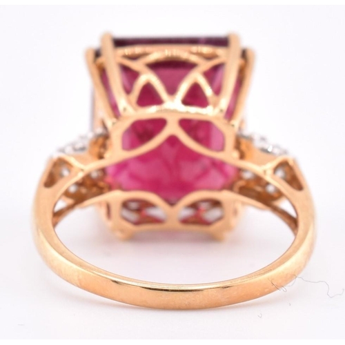 160 - A hallmarked 18ct gold pink tourmaline and diamond ring. The 18ct yellow gold ring set with a centra... 