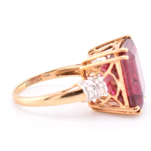 160 - A hallmarked 18ct gold pink tourmaline and diamond ring. The 18ct yellow gold ring set with a centra... 