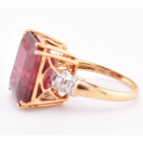 160 - A hallmarked 18ct gold pink tourmaline and diamond ring. The 18ct yellow gold ring set with a centra... 